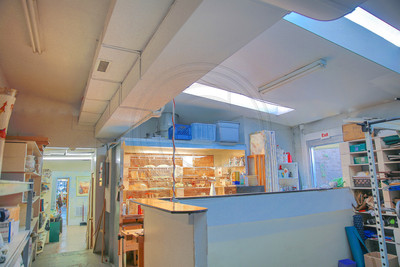 Two skylights illuminate the workspace in the rear of the building complete with a spray booth