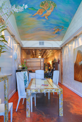 Unique 25' mural graces the ceiling of the two story entry space.