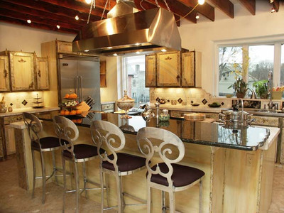 11' Long Ubatuba Marble counter overlooks Viking cooktop & kitchen w/ Antique Chestnut beams