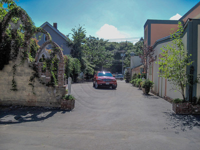 Wrap around parking lot exits on 11 Tour Ave.