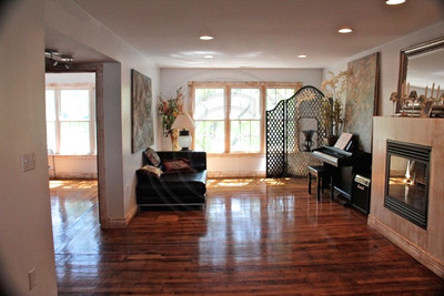 Antique hardwood flooring & Gas Fireplace add warmth year round